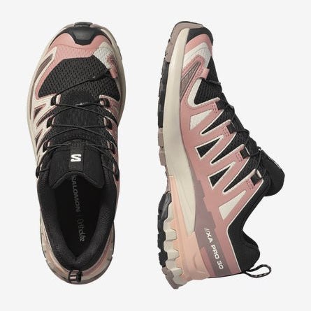 Pair of black and pink running shoes on a white background