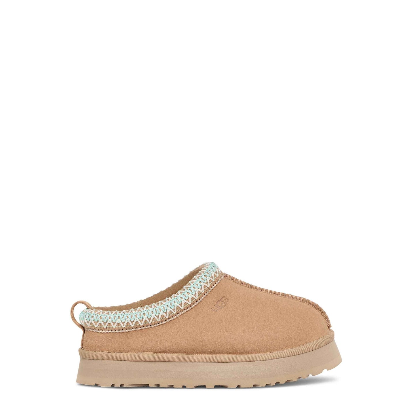 Tan slipper with white trim on a white background