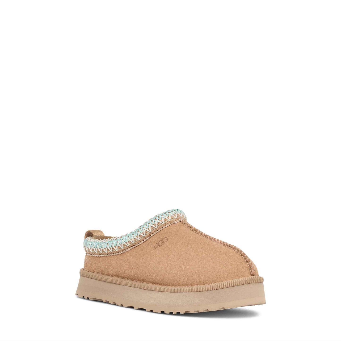 Tan slipper with white trim on a white background