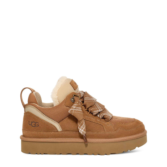 Brown UGG sneaker with fur lining on a white background