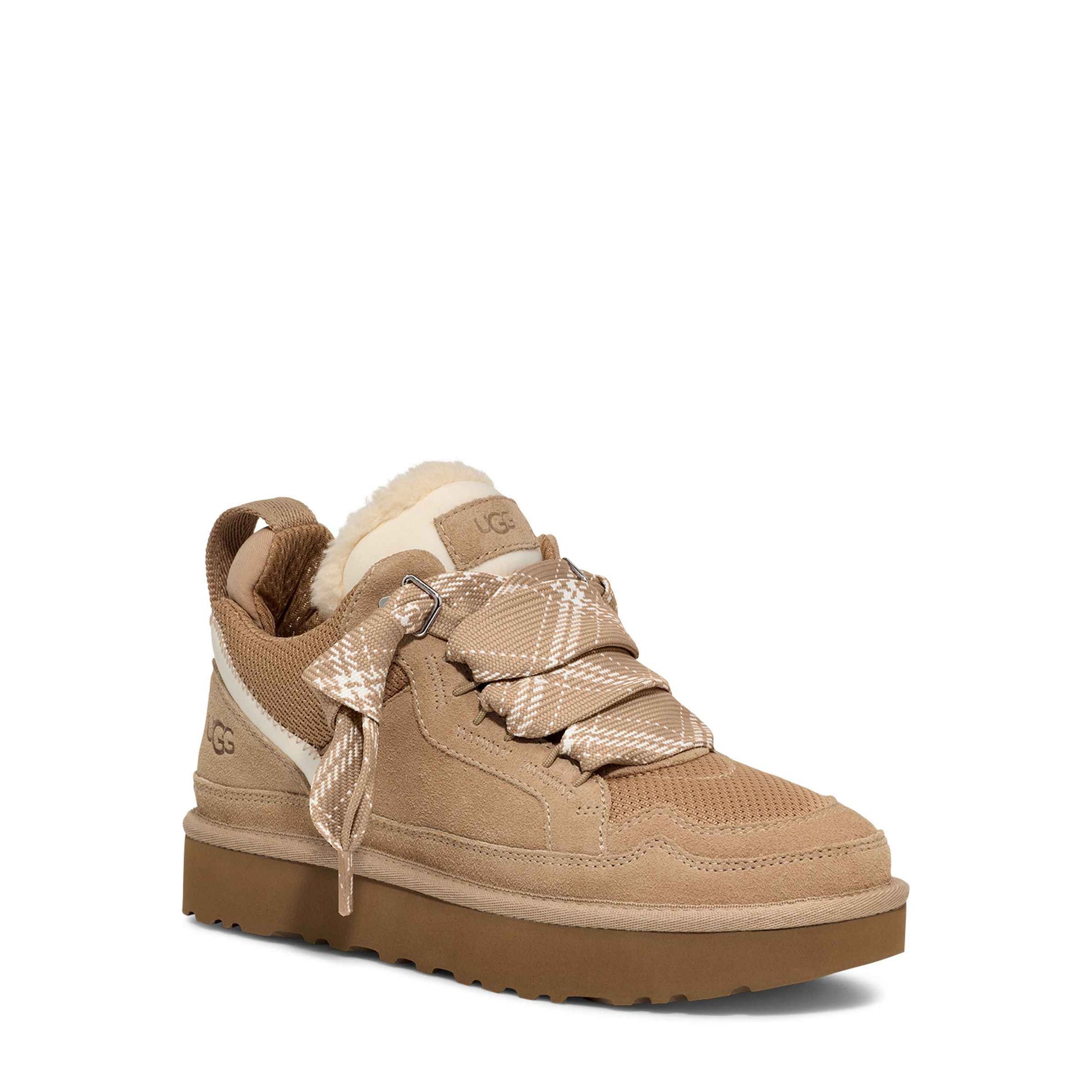 Tan sneaker with plaid pattern on a white background