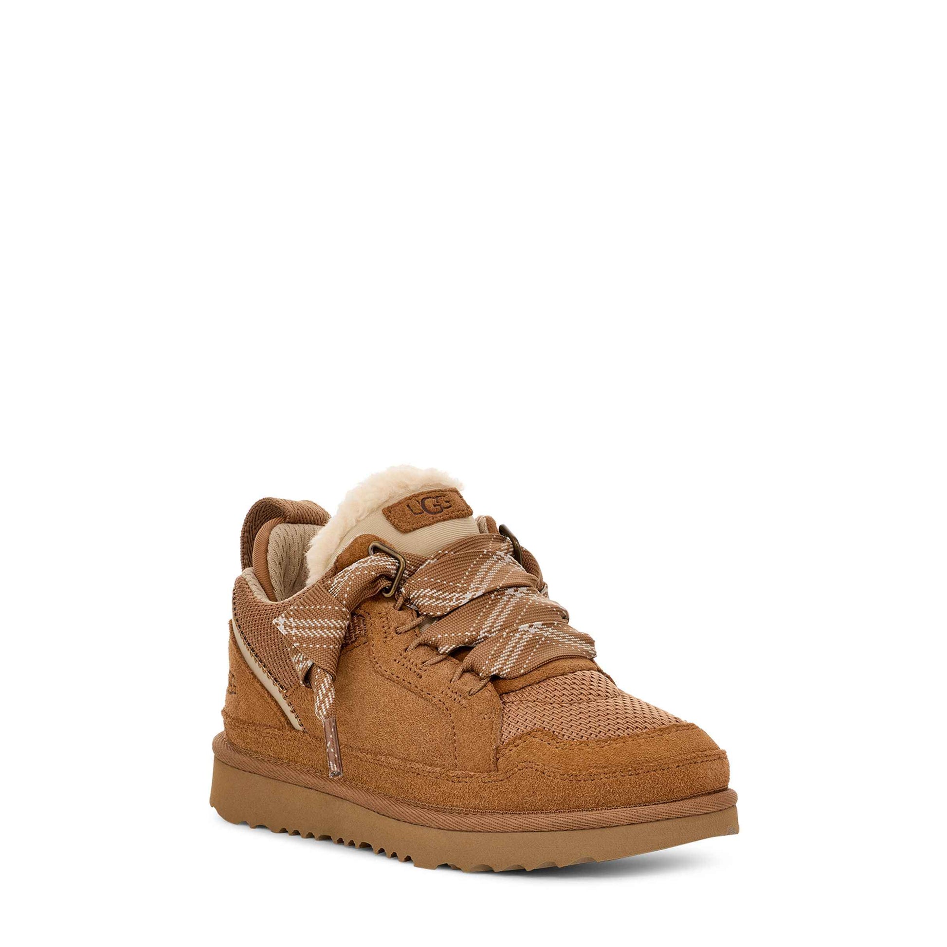Brown sneaker with white sole on a white background