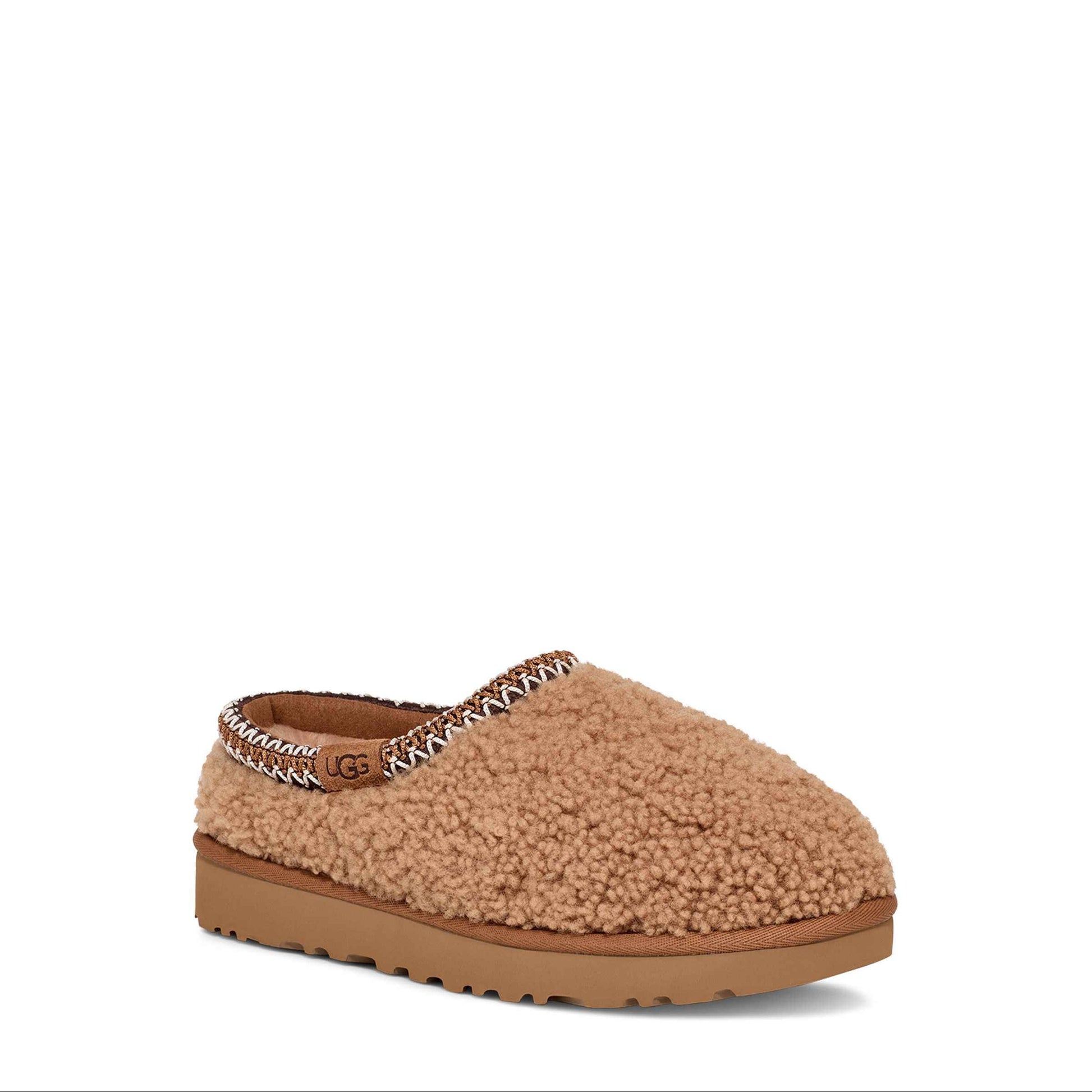 Brown slipper with fuzzy texture on a white background