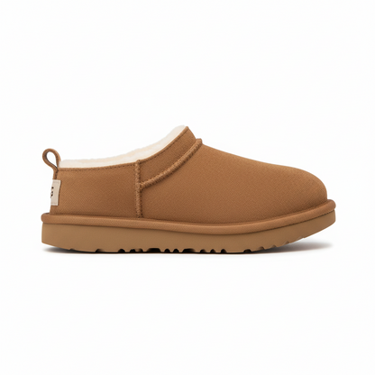 Brown slipper with beige interior on a white background