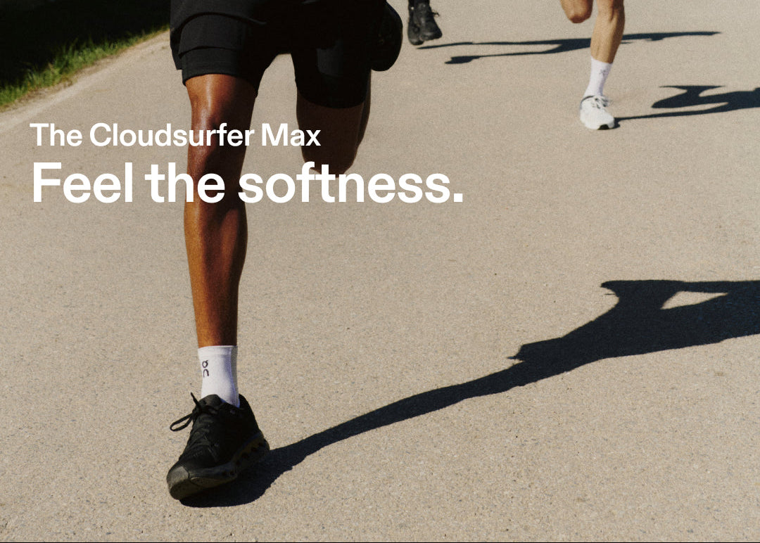 People running on a path with text 'The Cloudsurfer Max Feel the softness.'